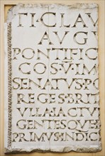 Close up of Latin inscription.