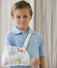 Boy with arm in sling.