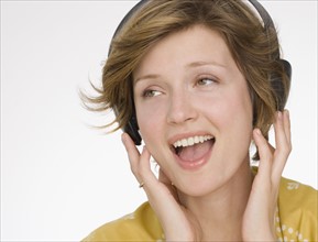 Woman listening to headphones.