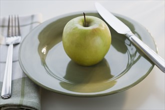 Apple on plate.