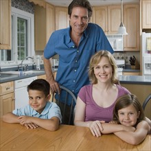 Family at kitchen table.