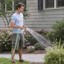 Man watering plants.