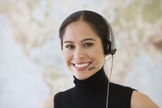Businesswoman wearing headset.