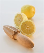 Lemon halves and hand juicer.