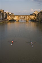 High angle view of people sculling, Ponte Vecchio, Florence, Italy.