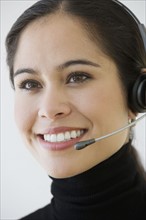 Businesswoman wearing headset.