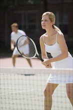 Couple playing tennis.
