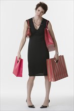 Woman holding shopping bags.
