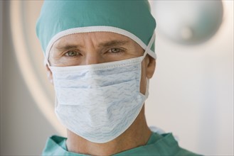 Male doctor wearing surgical mask.