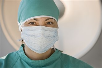 Female doctor wearing surgical mask.