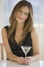 Woman drinking martini.