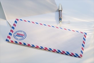International envelope and pen.