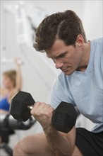 Man exercising with weight.