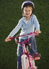 Girl riding bicycle.