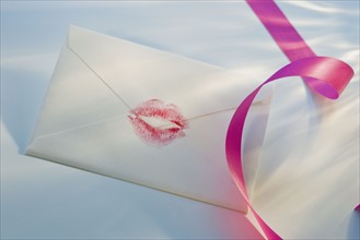 Envelope with lipstick kiss.
