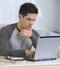 Man looking at laptop.