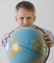 Man holding globe.