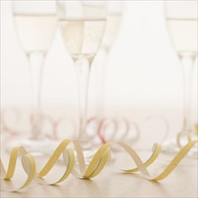 Closeup of champagne glasses with confetti. Date : 2006