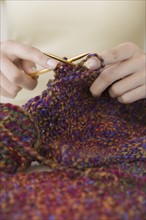 Close up of woman knitting.