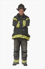 Male firefighter with arms crossed.