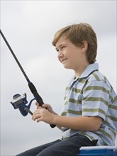 Close up of boy fishing.