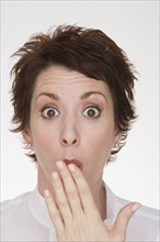 Woman making surprised face.