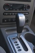 Close up of automatic gearshift in car.