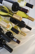 Assorted wine bottles on wine rack.