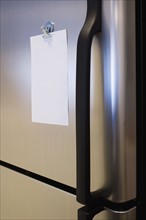 Blank note on refrigerator.