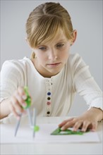 Teenaged girl doing homework.