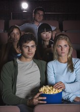 Couple in movie theater.