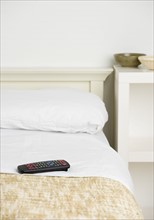 Still life of remote control on bed. Date : 2006