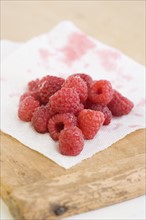 Close up of raspberries on napkin. Date : 2006