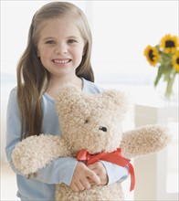 Portrait of girl hugging teddy bear. Date : 2006