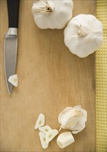 Chopped garlic on cutting board. Date : 2006