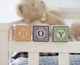 Boy spelled out with blocks on crib. Date : 2007