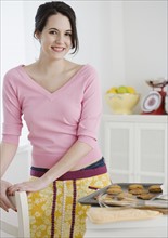 Portrait of woman baking cookies. Date : 2007