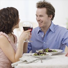 Couple toasting with wine. Date : 2007