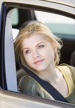 Woman sitting in passenger side of car. Date : 2007