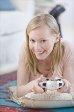 Woman playing video games. Date : 2007