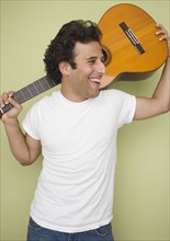 Man laughing and holding guitar. Date : 2007