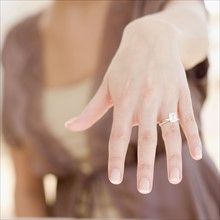 Woman showing off engagement ring. Date : 2007