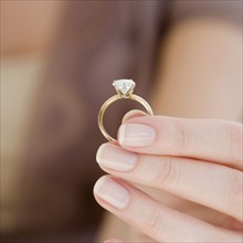 Woman holding engagement ring. Date : 2007