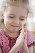 Close up of girl praying. Date : 2007