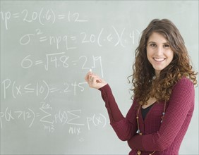 Portrait of female student in front of blackboard. Date : 2007