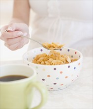 Woman eating cereal. Date : 2007