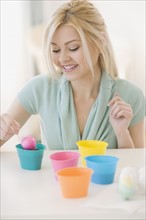 Woman dying Easter eggs. Date : 2007