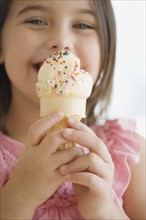 Close up of girl eating ice cream cone. Date : 2006