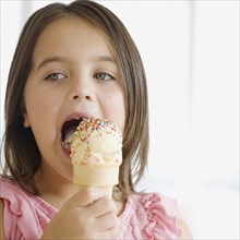 Close up of girl eating ice cream cone. Date : 2006