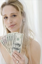Portrait of bride holding money. Date : 2007